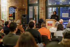 A group of people listening to a lecture.